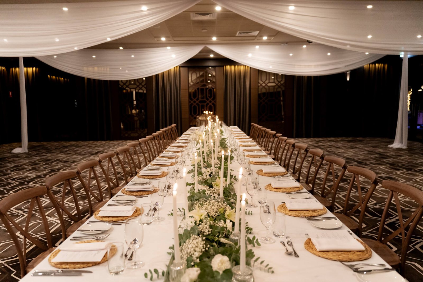 Long tables with greenery runners in the Founders Room