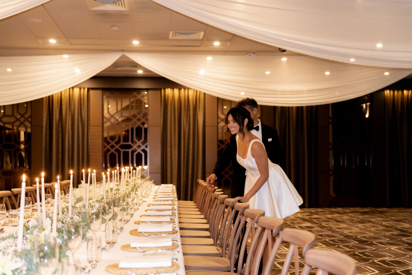 Long tables under a draped ceiling and fairy lights in the Founders Room